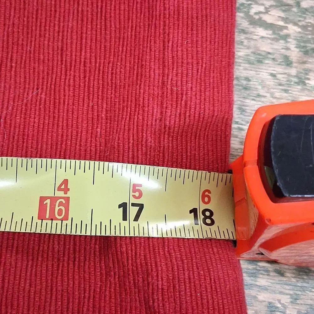 Set of 7‎ red corduroy placemats.